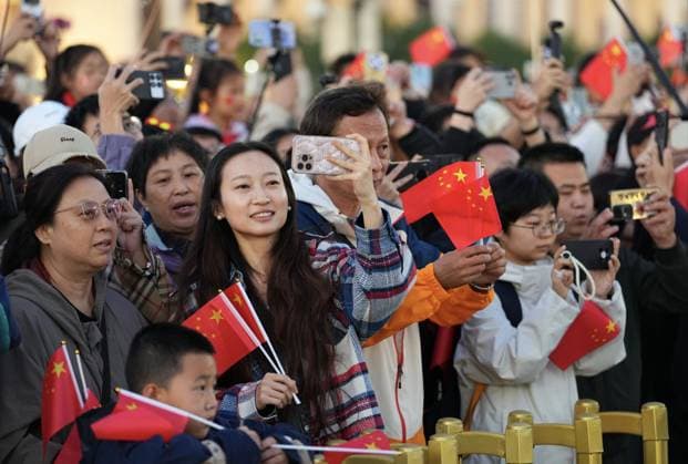 (251001) -- BEIJING, Oct. 1, 2025 -- People attend a flag-raising ceremony marking the 76th anniversary of the founding of the People s Republic of China at Tian anmen Square in Beijing, capital of China, Oct. 1, 2025. ) CHINA-BEIJING-NATIONAL DAY-FLAG-RAISING CEREMONY (CN) XingxGuangli