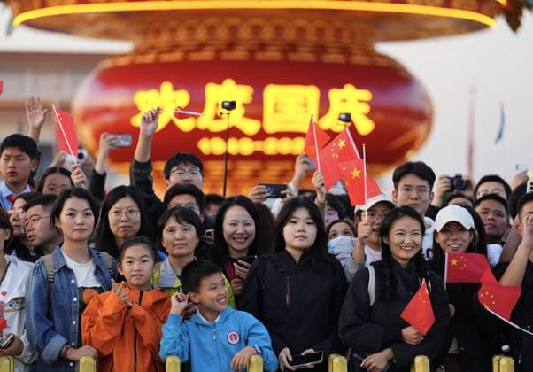 251001 -- BEIJING, Oct. 1, 2025 -- People attend a flag-raising ceremony marking the 76th anniversary of the founding of the People s Republic of China at Tian anmen Square in Beijing, capital of China, Oct. 1, 2025. CHINA-BEIJING-NATIONAL DAY-FLAG-RAISING CEREMONY CN XingxGuangli CHINA-BEIJING-NATIONAL DAY-FLAG-RAISING CEREMONY (CN) IMAGO XingxGuangli imago images 1067189664