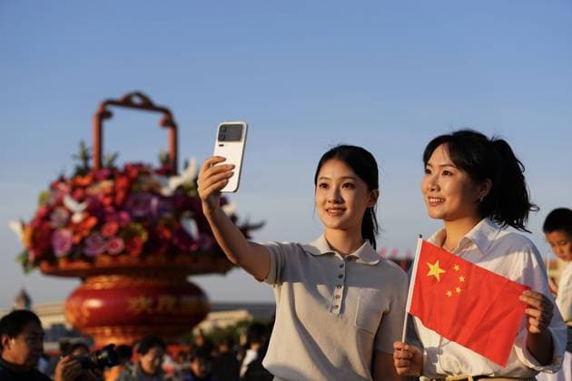 251001 -- BEIJING, Oct. 1, 2025 -- People attend a flag-raising ceremony marking the 76th anniversary of the founding of the People s Republic of China at Tian anmen Square in Beijing, capital of China, Oct. 1, 2025. CHINA-BEIJING-NATIONAL DAY-FLAG-RAISING CEREMONY CN XingxGuangli CHINA-BEIJING-NATIONAL DAY-FLAG-RAISING CEREMONY (CN) IMAGO XingxGuangli imago images 1067189666