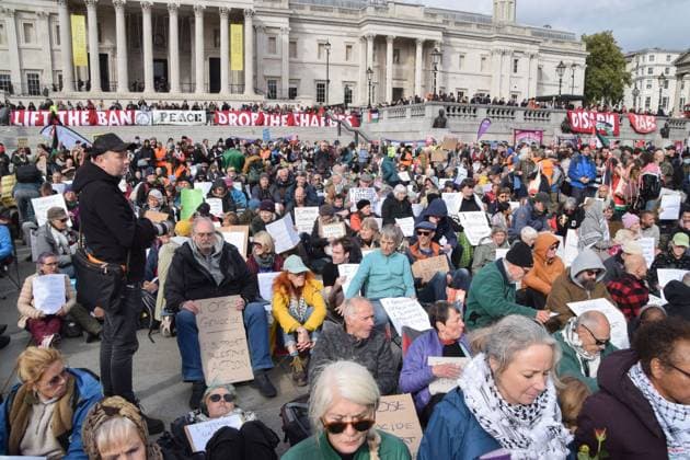 October 4, 2025, London, United Kingdom: Protesters hold placards stating I Oppose Genocide, I Support Palestine Action during the demonstration in Trafalgar Square. Hundreds of people gathered to show support for the activist group Palestine Action, which has been banned under anti-terrorism law, and demanded that the ban is lifted. London United Kingdom - ZUMAs197 20251004_aaa_s197_241 Copyright: xVukxValcicx