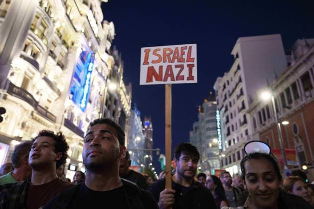 October 4, 2025, Madrid, Madrid, Spain: Protesters hold banners and Palestinian banners during a demonstration in solidarity with the Palestinians in the Gaza strip, in Madrid. Madrid Spain - ZUMA- Oc 20251004_zsp_d308_010 Copyright: xJuanxCarlosxLucasx