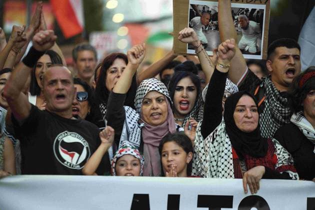 October 4, 2025, Madrid, Madrid, Spain: Protesters hold banners and Palestinian banners during a demonstration in solidarity with the Palestinians in the Gaza strip, in Madrid. Madrid Spain - ZUMA- Oc 20251004_zsp_d308_014 Copyright: xJuanxCarlosxLucasx