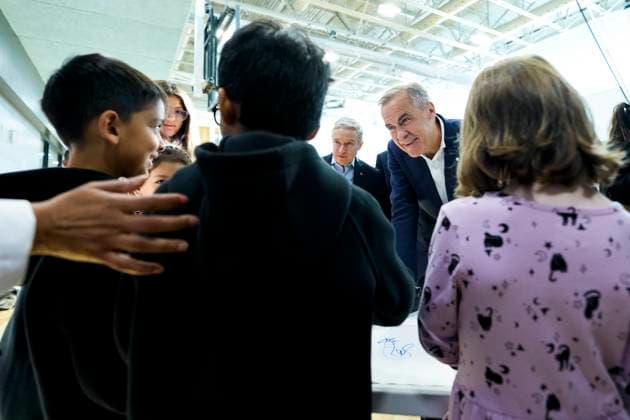 October 10, 2025, Ottawa, On, CAN: Prime Minister Mark Carney speaks with children making art at a community centre before participating in an announcement in Ottawa, on Friday, Oct. 10, 2025. Ottawa CAN - ZUMAc35_ 20251010_zaf_c35_007 Copyright: xJustinxTangx