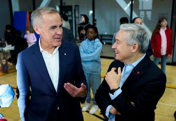 October 10, 2025, Ottawa, On, CAN: Prime Minister Mark Carney jokes with Minister of Finance and National Revenue Francois-Philippe Champagne as they greet families before participating in an announcement at a community centre in Ottawa, on Friday, Oct. 10, 2025. Ottawa CAN - ZUMAc35_ 20251010_zaf_c35_014 Copyright: xJustinxTangx