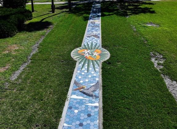October 13, 2025, St. Petersburg, Florida, USA: An aerial drone view of The Sunshine City Mosaic sidewalk mural at Sunset Park, 7340 Central Ave, on Monday, Oct. 13, 2025 in St. Petersburg. The 175 foot long side walk mural is the largest in the Southeast. St. Petersburg USA - ZUMAidew 20251013_zan_s70_050 Copyright: xDirkxShaddx