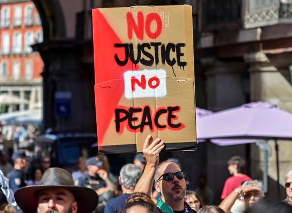 October 15, 2025, Madrid, Madrid, SPAIN: Demonstrators gather outside the Ministry of Foreign Affairs in Madrid during the general strike on October 15, 2025, held in support of the Palestinian people. The protest is part of international actions calling for an end to the offensive in Gaza and for Spain to sever relations with the Israeli government. Madrid SPAIN - ZUMAz108 20251015_znp_z108_053 Copyright: xRichardxZubelzux