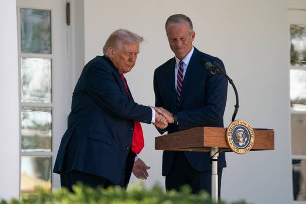 President Donald Trump shakes hands with Senate Majority Leader John ThuneX R-SD, during a lunch with Republican Senators in the Rose Garden of the White House in Washington, DC on Tuesday, October 21, 2025. Influential conservative groups with deep pockets are pushing Republicans to demand steep concessions from Democrats in exchange for extending health care subsidies, a move that risks prolonging a US government shutdown now in its 21st day. WASP20251021110 ALLISONxROBBERT