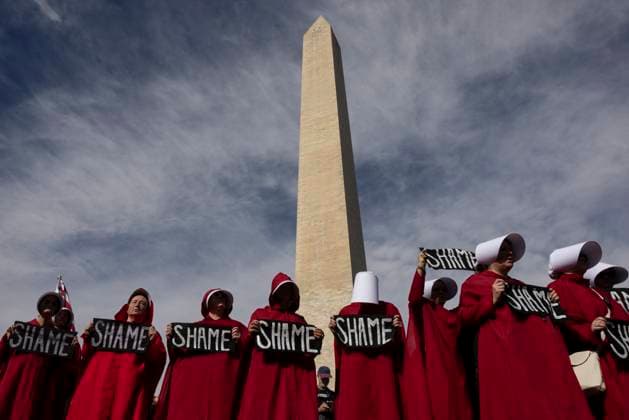 November 5, 2025, Washington, District Of Columbia, United States: People take part in the â€oeTrump Must Go†protest near the Washington Monument in Washington, D.C., U.S., November 5, 2025. Hundreds rallied at the National Mall on the first anniversary of Donald Trumpâ€⠢s re-election to protest his administration and the ongoing government shutdown, the second-longest in U.S. history, which has caused widespread layoffs. Washington United States - ZUMAe119 20251105_znp_e119_018 Copyright: xMehmetxEserx