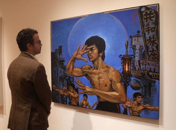 November 7, 2025, New York, New York, USA: A man looks at Clones of Bruce Lee, by artist Martin Wong, estimate $350,000 - $600,000, during November Marquee Week 2025 during SothebyÃ¢â‚¬â ¢s Opening of the New Global Headquarters at the Breuer. New York USA - ZUMAk03_ 20251107_zaf_k03_066 Copyright: xNancyxKaszermanx