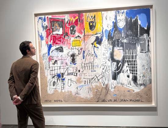 November 7, 2025, New York, New York, USA: A man looks at Crowns (Peso Neto) 1981 by artist Jean-Michel Basquiat, estimate $35 million - $45 million, seen on display during November Marquee Week 2025 during SothebyÃ¢â‚¬â ¢s Opening of the New Global Headquarters at the Breuer. New York USA - ZUMAk03_ 20251107_zaf_k03_115 Copyright: xNancyxKaszermanx