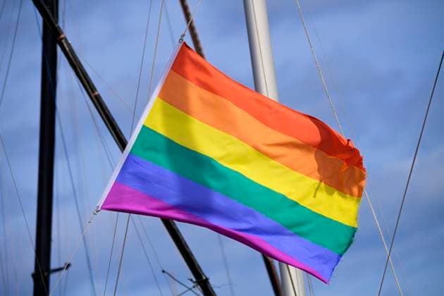 Waving rainbow flag in Niendorf, Schleswig Holstein, Germany ** NUR FUER REDAKTIONELLE ZWECKE ** EDITORIAL USE ONLY **