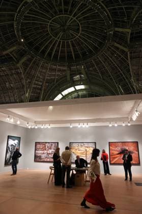Visitors to the 2025 Paris Photo Fair on the opening day at the Grand Palais, on Wednesday, November 12, 2025. The world s most important international photography fair brings together iconic and emerging names, showcasing 179 galleries from 33 countries and a rich programme that encompasses photography in all its forms, from silver gelatin to blockchain.  PAR20251112119 MAYAxVIDON-WHITE