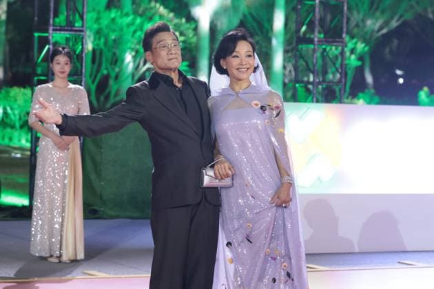 XIAMEN, CHINA - NOVEMBER 15: Actress Joan Chen (R) and actor Tony Leung Ka-fai arrive at the red carpet for the closing ceremony during the 38th China Golden Rooster Awards on November 15, 2025 in Xiamen, Fujian Province of China.  Copyright: xVCGx 111604072989