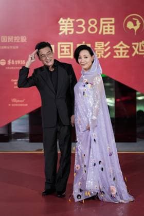 XIAMEN, CHINA - NOVEMBER 15: Actress Joan Chen (R) and actor Tony Leung Ka-fai arrive at the red carpet for the closing ceremony during the 38th China Golden Rooster Awards on November 15, 2025 in Xiamen, Fujian Province of China.  Copyright: xVCGx 111604093457
