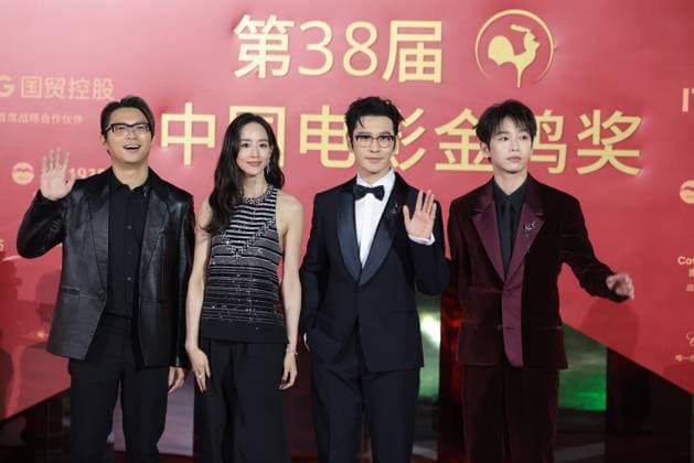XIAMEN, CHINA - NOVEMBER 15: (L-R) Director Sam Quah, actress Ning Chang, actor Huang Xiaoming and actor Peng Yuchang of The Fire Raven arrive at the red carpet for the closing ceremony during the 38th China Golden Rooster Awards on November 15, 2025 in Xiamen, Fujian Province of China.  Copyright: xVCGx 111604072216