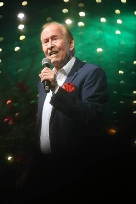 German music legends Born on July 29, 1943, Lothar Bernhard Walter, who achieved great success as a pop singer and film actor under his stage name Michael Holm, sings on a stage in Essen Steele at the local Christmas market in the run-up to Christmas Essen North Rhine-Westphalia Germany Steele