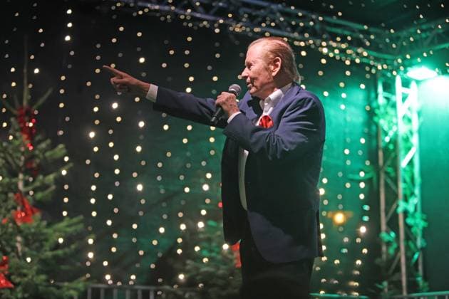 German music legends Born on July 29, 1943, Lothar Bernhard Walter, who achieved great success as a pop singer and film actor under his stage name Michael Holm, sings on a stage in Essen Steele at the local Christmas market in the run-up to Christmas Essen North Rhine-Westphalia Germany Steele