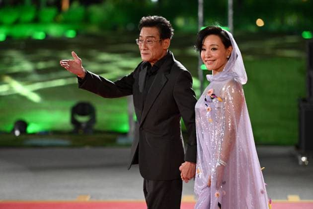 XIAMEN, CHINA - NOVEMBER 15: Actress Joan Chen (R) and actor Tony Leung Ka-fai arrive at the red carpet for the closing ceremony during the 38th China Golden Rooster Awards on November 15, 2025 in Xiamen, Fujian Province of China.  Copyright: xChinaxNewsxServicex 111604092438