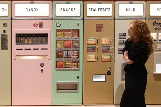 Wes Anderson: The Archives Press Preview at Design Museum, London, UK A staff member views A bank of Vending Machines created for Asteroid City by Atelier Simon Weisse and Erica Dorn (2021) at a photocall for The Design Museum s Wes Anderson: The Archives Exhibition at The Design Museum in London, England, UK on Monday 17 November 2025. The exhibition runs from 21 November 2025 - 26 July 2026., Credit:Justin Ng Avalon UK, England, London, Design Museum  Copyright: xJustinxNgx xAvalonx 1052941831