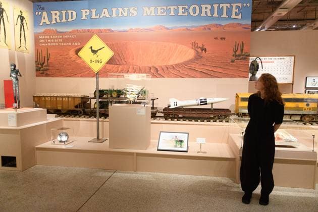 Wes Anderson: The Archives Press Preview at Design Museum, London, UK A staff member views Props created for Asteroid City at a photocall for The Design Museum s Wes Anderson: The Archives Exhibition at The Design Museum in London, England, UK on Monday 17 November 2025. The exhibition runs from 21 November 2025 - 26 July 2026., Credit:Justin Ng Avalon UK, England, London, Design Museum  Copyright: xJustinxNgx xAvalonx 1052941842