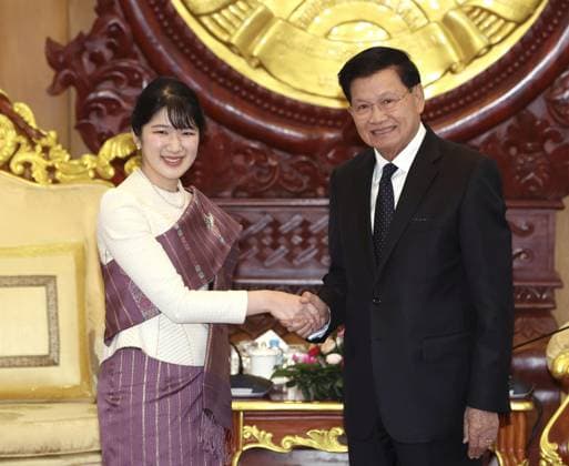 Japan Princess Aiko in Laos Japanese Princess Aiko shakes hands with Lao President Thongloun Sisoulith in Vientiane on Nov. 18, 2025, as she visits Laos on her first official overseas trip, marking the 70th anniversary of the establishment of diplomatic ties. (Pool photo)  A14AA0005043913P