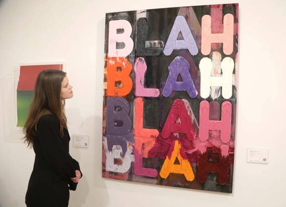 November 18, 2025, New York, New York, USA: A woman looks at Ã¢â‚¬ËœBlah, Blah, BlahÃ¢â‚¬â ¢ by artist Mel Bochner, 2013, estimate $60,000 - $80,000, seen on display at the press preview for Marquee Week Fall 2025 Modern and Comtempory Art held at Phillips Auction House New York. New York USA - ZUMAk03_ 20251118_zaf_k03_103 Copyright: xNancyxKaszermanx