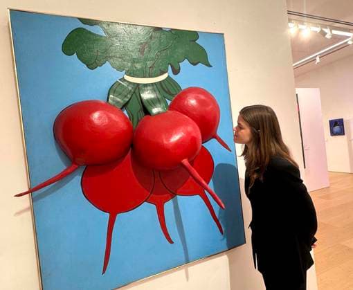 November 18, 2025, New York, New York, USA: A woman looks at Ã¢â‚¬ËœRed On BlueÃ¢â‚¬â ¢ 1964, by artist Marjorie Strider, estimate $30,000 - $50,000, seen on display at the press preview for Marquee Week Fall 2025 Modern and Comtempory Art held at Phillips Auction House New York. New York USA - ZUMAk03_ 20251118_zaf_k03_125 Copyright: xNancyxKaszermanx