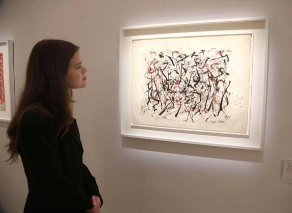November 18, 2025, New York, New York, USA: A woman looks at Ã¢â‚¬ËœUntitledÃ¢â‚¬â ¢, circa 1947, by artist Jackson Pollack, estimate $2.8 million - $3.5 million, seen on display at the press preview for Marquee Week Fall 2025 Modern and Comtempory Art held at Phillips Auction House New York. New York USA - ZUMAk03_ 20251118_zaf_k03_091 Copyright: xNancyxKaszermanx