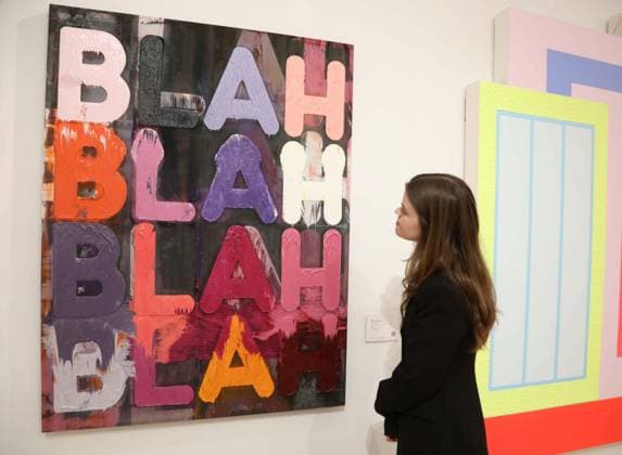 November 18, 2025, New York, New York, USA: A woman looks at Ã¢â‚¬ËœBlah, Blah, BlahÃ¢â‚¬â ¢ by artist Mel Bochner, 2013, estimate $60,000 - $80,000, seen on display at the press preview for Marquee Week Fall 2025 Modern and Comtempory Art held at Phillips Auction House New York. New York USA - ZUMAk03_ 20251118_zaf_k03_101 Copyright: xNancyxKaszermanx