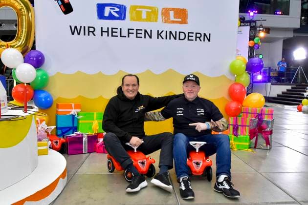 abb presenter Wolfram Kons and Joey Kelly musician athlete in the Bobbycar slide cars in the RTL studio at the photo session for the 24 hour charity birthday challenge 30th birthday of the RTL Spendenmarathon wir helfen Kindern bei RTL Deutschland on 19 11 2025 in Cologne Deutz NRW Germany