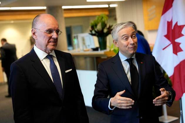November 19, 2025, Ottawa, On, CAN: Minister of Finance and National Revenue Francois-Philippe Champagne and Jan Carlson, chair of Ericsson s board of directors, left, await the arrival of Sweden s King Carl XVI Gustaf and Queen Silvia, not shown, at the Ericsson Research & Development facility in Ottawa, on Wednesday, Nov. 19, 2025. Ottawa CAN  - ZUMAc35_ 20251119_zaf_c35_042 Copyright: xJustinxTangx