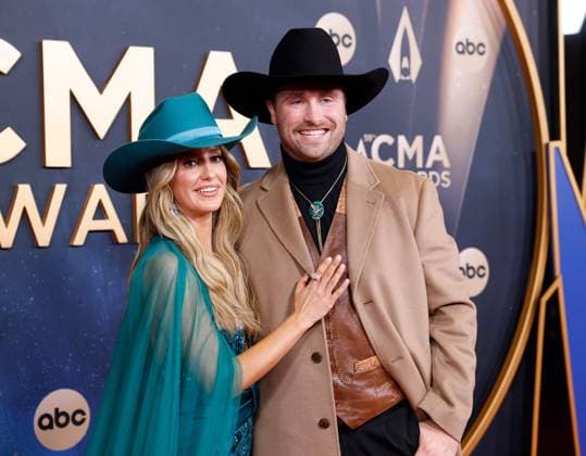 (L-R) Lainey Wilson and Devlin Duck Hodges arrive on the red carpet for the 59th CMA Awards in Nashville, Tennessee, on Wednesday, November 19, 2025.  NAS20251119190 JOHNxANGELILLO