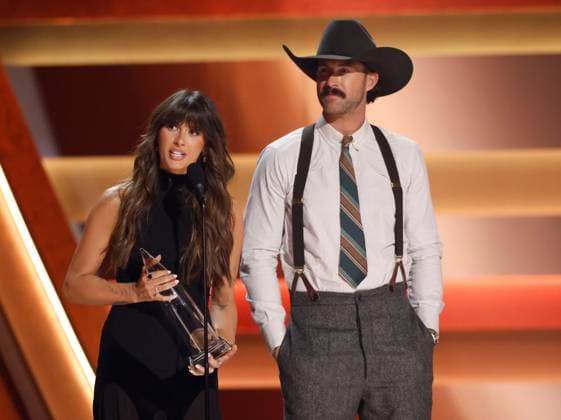 (L-R) Ella Langley and Riley Green accept the award for Song of the Year for you look like you love me onstage during the 59th CMA Awards at the Bridgestone Arena in Nashville, Tennessee, on Wednesday, November 19, 2025.  NAS20251119315 JOHNxANGELILLO