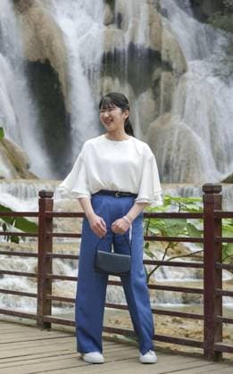 Japan Princess Aiko in Laos Japanese Princess Aiko poses for a photo in front of Kuang Si Falls in the ancient Lao capital of Luang Prabang during her official trip to Laos on Nov. 20, 2025. (Pool photo)  A14AA0005048797P