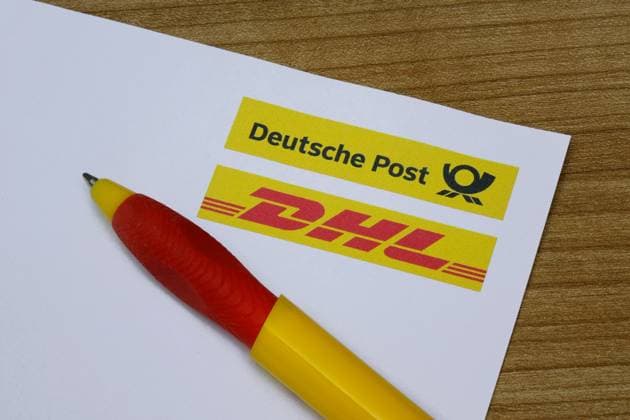Letterhead with Deutsche Post and DHL and ballpoint pen Letterhead with Deutsche Post and DHL and ballpoint pen, 16 11 2025, Borkwalde, Brandenburg, The Deutsche Post and DHL logos and a ballpoint pen are on the letterhead
