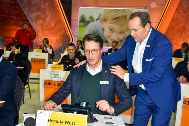 ABB Hendrik Josef Wüst Wuest CDU politician with Wolfram Kons Moderator State Premier of North Rhine-Westphalia North Rhine-Westphalia as a guest on the donation phone in the RTL studio at the charity for the 30th anniversary of the RTL telethon we help children at RTL Germany on 21 11 2025 2 Donation Day in Cologne Deutz NRW Germany