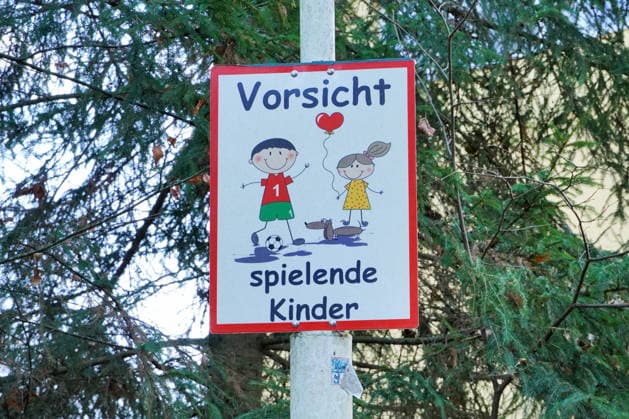 slow drive, voluntary Speed limit, Caution playing Children, Individual Shield with Text and Pictogram 1131606705