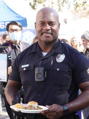 26 November 2025 - Los Angeles, California - Officer Deon Joseph,. 2025 Thanks & Giving On Skid Row held at Los Angeles Mission. Photo Copyright: xAdMediax