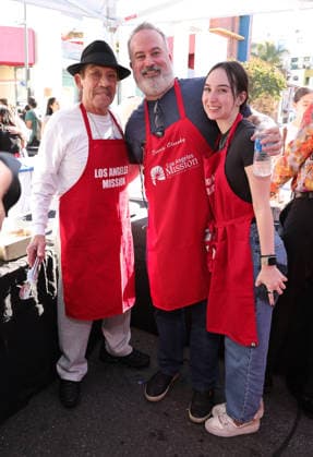 26 November 2025 - Los Angeles, California - Danny Trejo, Dennis Oleesky, Samantha Oleesky. 2025 Thanks & Giving On Skid Row held at Los Angeles Mission. Photo Copyright: xAdMediax
