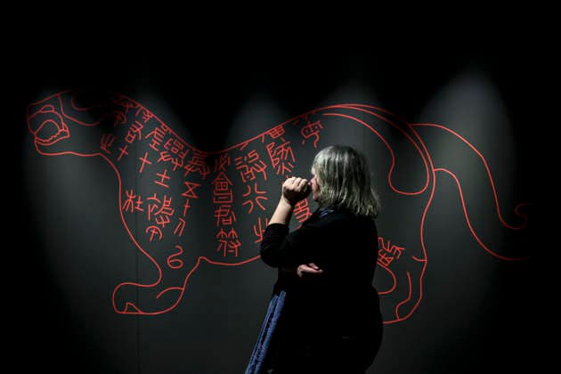 (251128) -- BUDAPEST, Nov. 28, 2025 -- A woman visits the exhibition Civilization of the Qin and Han Dynasties - The First Chinese Emperor s Terracotta Warriors at the Museum of Fine Arts in Budapest, Hungary, Nov. 27, 2025. The Museum of Fine Arts in Budapest on Thursday opened one of the most significant Chinese cultural exhibitions ever held in Hungary, presenting more than 150 ancient artworks from the Qin and Han dynasties (221 BC-220 AD), including ten original Terracotta Warriors. Titled Civilization of the Qin and Han Dynasties - The First Chinese Emperor s Terracotta Warriors, the exhibition is jointly organized by the Museum of Fine Arts in Budapest and the Shaanxi Provincial Cultural Heritage Administration, and it will r 