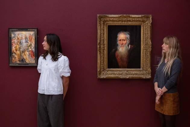 November 28, 2025, London, England, United Kingdom: Sotheby s staff members stand beside Sir Peter Paul Rubens The Virgin and Child with Saint Anne adored by Saints of the House of Habsburg, estimated at 2,000,000-3,000,000 GBP, and Portrait Study of an Old Man, estimated at 1,000,000-1,500,000 GBP, during a preview at Sotheby s in London on 28 November 2025. Both paintings will be offered in the Old Masters and 19th Century Paintings sale on 3 December. London United Kingdom - ZUMAk172 20251128_zip_k172_031 Copyright: xThomasxKrychx
