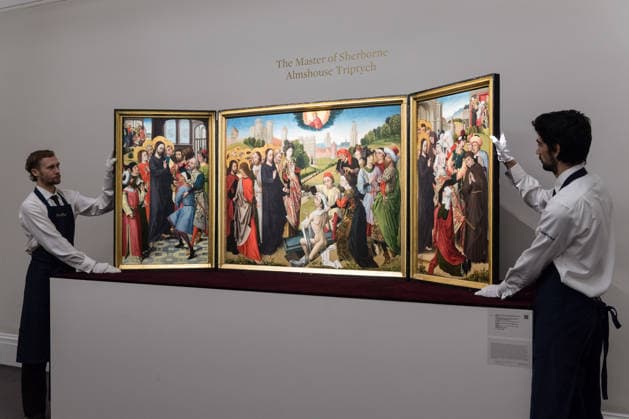 November 28, 2025, London, England, United Kingdom: Art handlers look at A triptych with the five miracles of Christ by the Master of the Sherborne Almshouse Triptych, estimate: 2,500,000 - 3,500,000 GBP during a photocall at Sotheby s auction house ahead of Old Master & 19th Century Paintings Sales. London United Kingdom - ZUMAs371 20251128_zip_s371_015 Copyright: xWiktorxSzymanowiczx