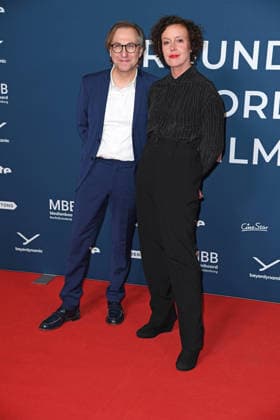 Festival director Bernhard Karl, film patron Maria Schrader at the festival opening of AROUND THE WORLD IN 14 FILMS at the cinema in the Kulturbrauerei in Berlin on 28 11 2025