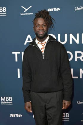 Mohamed Ndiaye at the festival opening and the premiere of the feature film Sentimental Value at the 20th Around the World in 14 Films festival at the KulturBrauerei cinema in Berlin, 28 11 2025 Foto:xM.xBehrensx xFuturexImagex world_5121