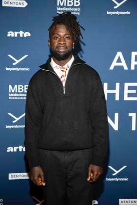 ABBberlin Mohamed Ndiaye on the red carpet at the festival opening AROUND THE WORLD IN 14 FILMS at Cinestar Kino in der Kulturbrauerei Berlin on 28 11 2025 Berlin Germany