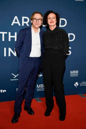 ABBberlin Bernhard Karl and Maria Schrader as guests on the red carpet at the festival opening AROUND THE WORLD IN 14 FILMS at Cinestar Kino in der Kulturbrauerei Berlin on 28 11 2025 Berlin Germany