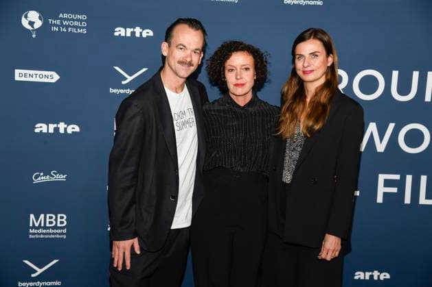 ABBberlin Jonas Dornbach, Maria Schrader and Janine Jackowski as guests on the red carpet at the festival opening AROUND THE WORLD IN 14 FILMS at Cinestar Kino in der Kulturbrauerei Berlin on 28 11 2025 Berlin Germany