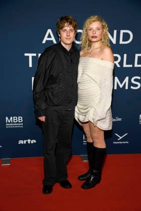 ABBberlin Louis Hofmann with Luisa Celine Gaffron German actors as guests on the red carpet at the festival opening AROUND THE WORLD IN 14 FILMS at Cinestar Kino in der Kulturbrauerei Berlin on 28 11 2025 Berlin Germany
