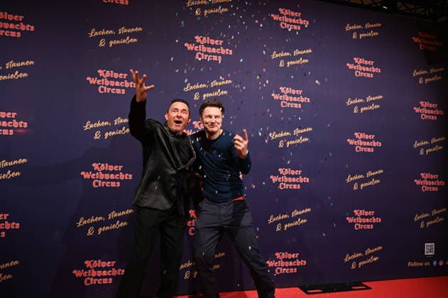 Presenter Markus Köllner and Andre Gatzke, l r, attend the premiere of the 10th Cologne Christmas Circus