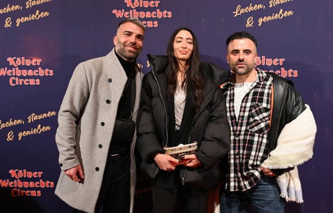 Performers Rafi Rachek, Nina Baracai, Eddy Yildiz, l r, attend the premiere of the 10th Cologne Christmas Circus